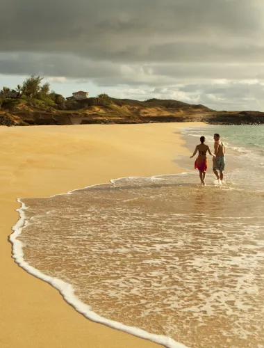 West End A couple on an empty beach in the west end of Molokai