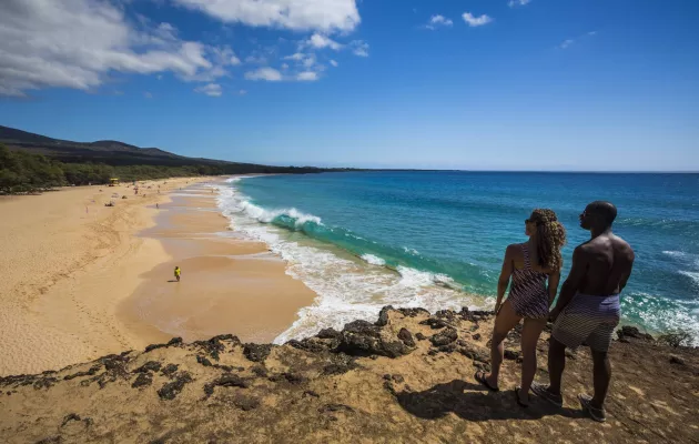 Couple overlooking beach in Hawaii