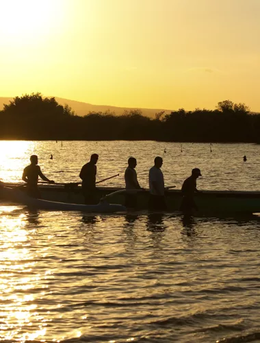 Molokai Activities Outrigger canoeing at sunset off the Hawaiian island of Molokai